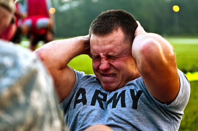 Sgt. David W. Rider, a 2010 Army Reserve Best Warrior competitor and practical nurse from Strongsville, Ohio, assigned to Bravo Company, 256th Combat Support Hospital, grimaces during the push-up event while taking the Army Physical Fitness Test at Fort McCoy, Wis., July 26, 2010.